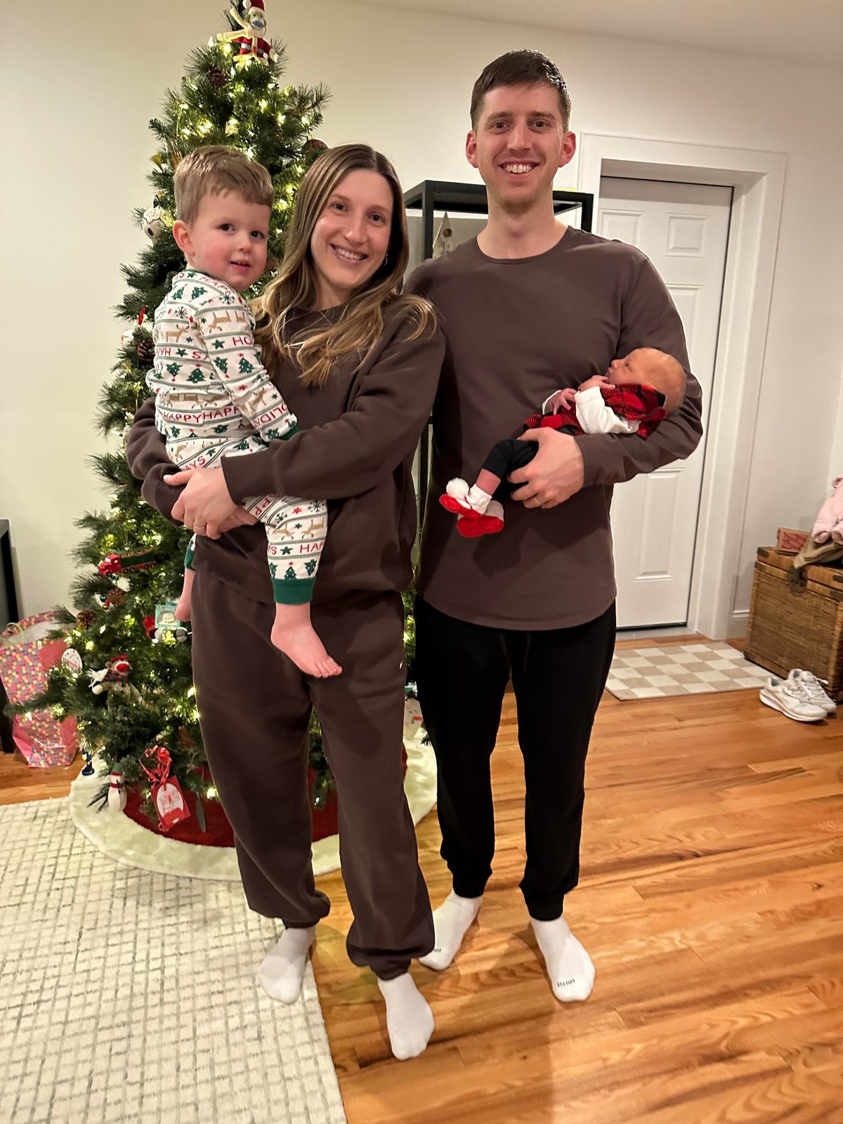 Callie's family at Christmas: Rowan in his mom's arms and newborn Callie in her dad's