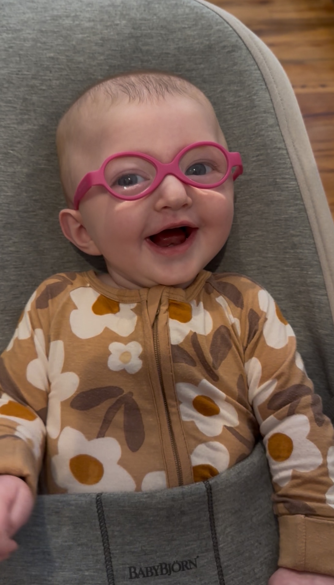 Callie smiling wide in her pink glasses