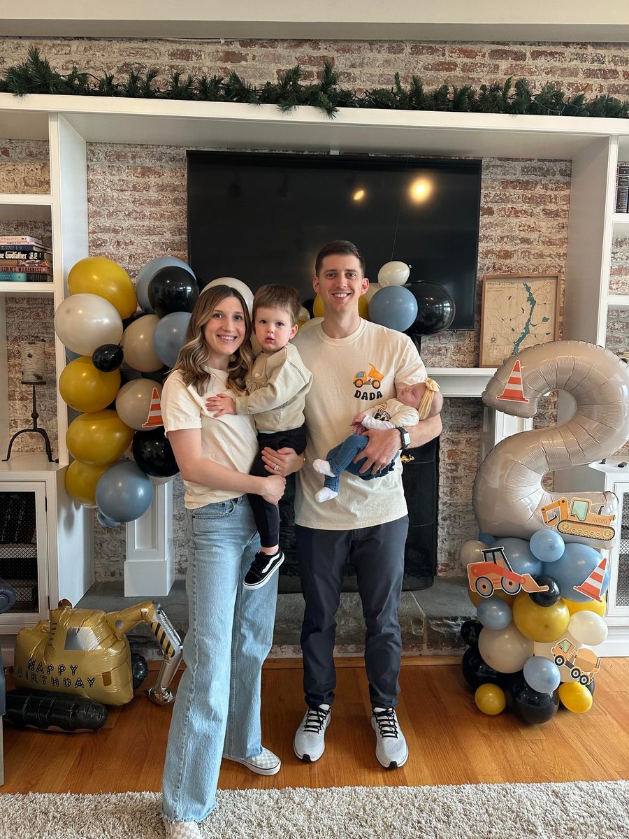 The Alt family at a birthday party, with newborn Callie in her dad's arms